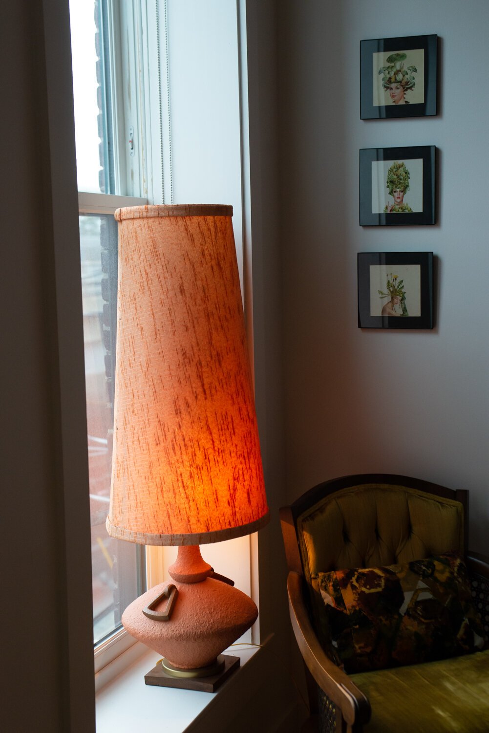 A favorite, oversized orange lamp in the window is a custom mid-century piece found at Mercantile On Main in Fort Wayne.