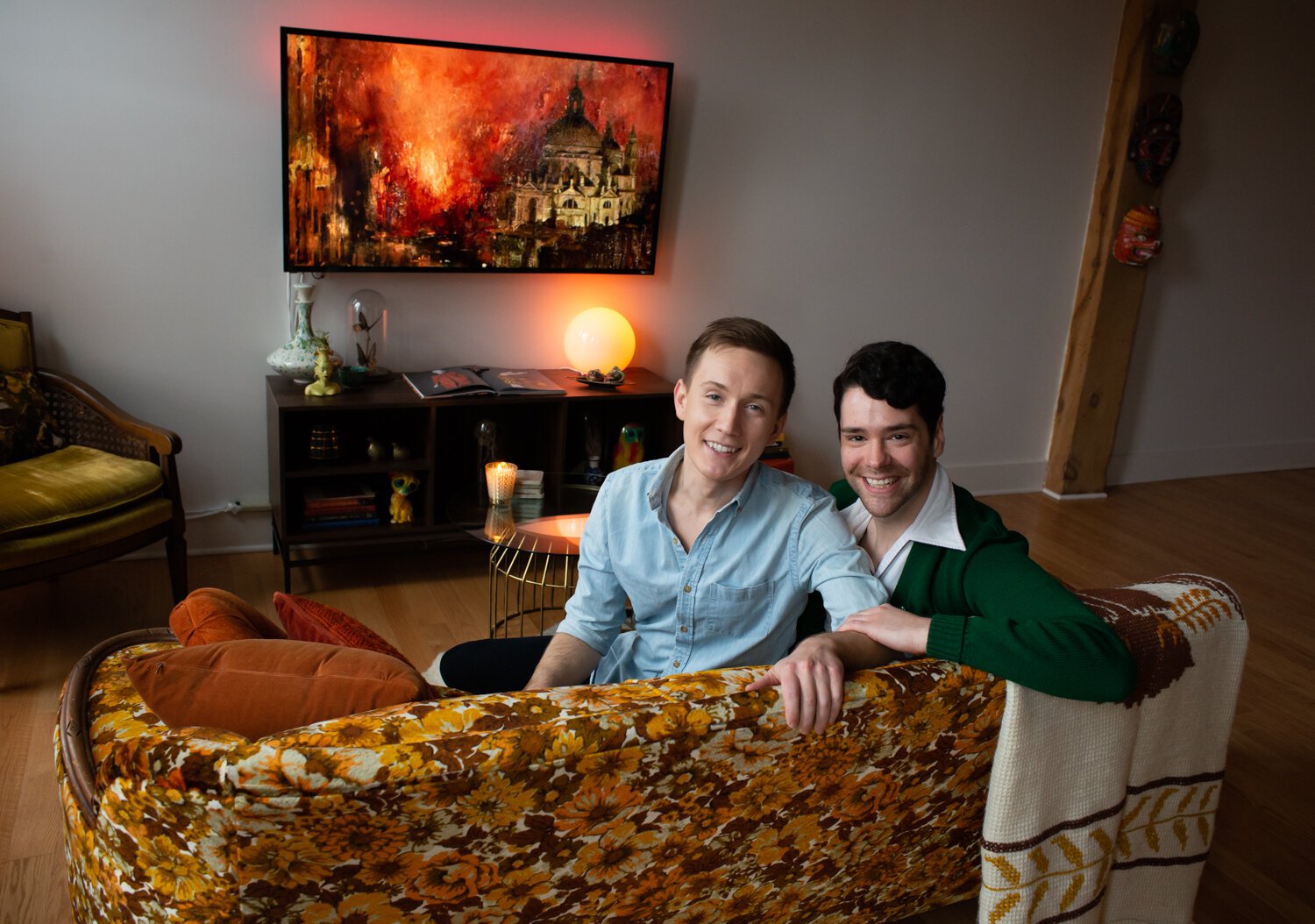 Michael Bartkiewicz and Henry DuRocher relax on the couch in their downtown Fort Wayne home.