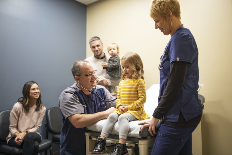 Dr. Todd Page carea for a patient at Sweetwater's clinic.