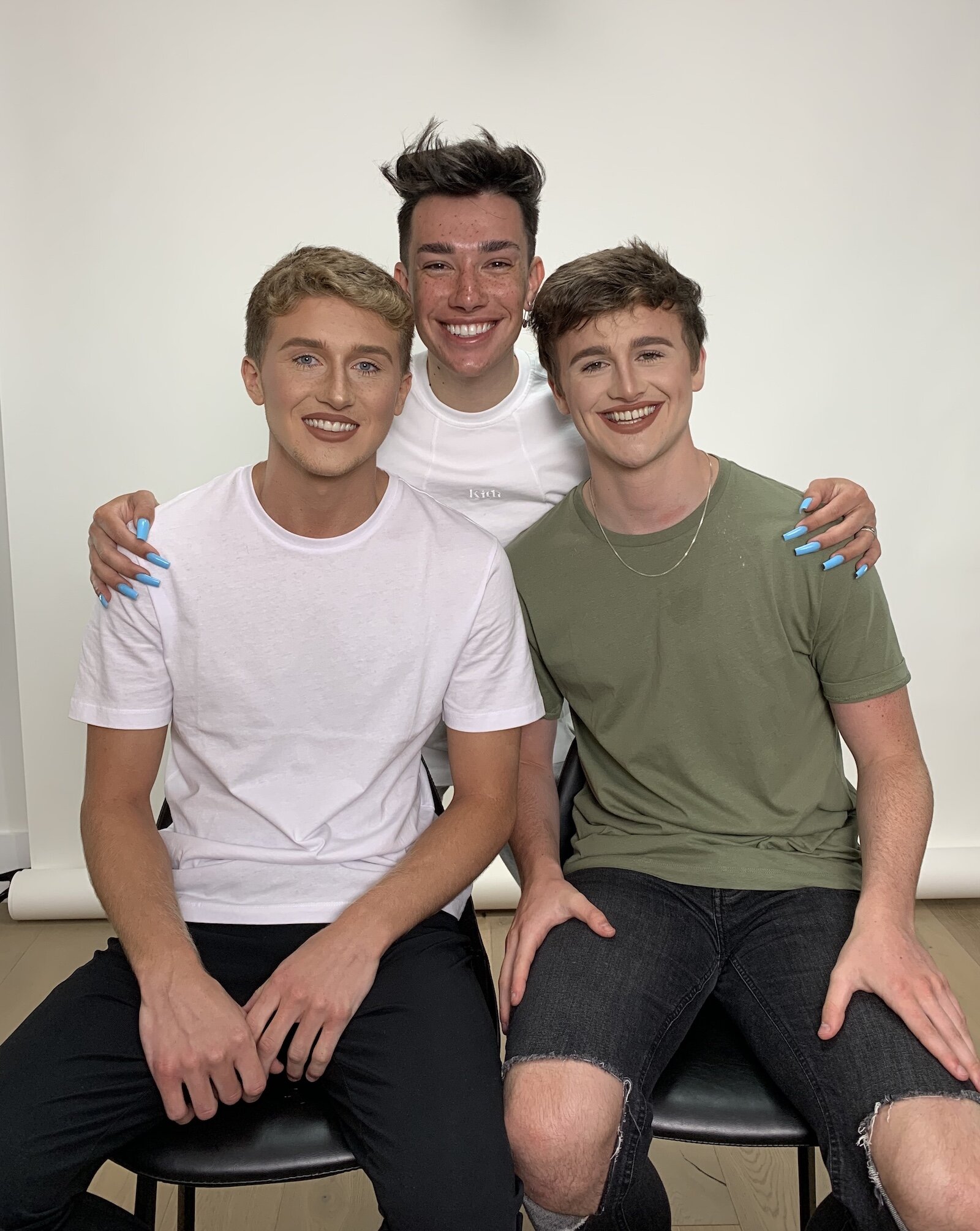 The Cheeky Boyos pose with YouTube makeup artist James Charles, center, who gave them a glam look.
