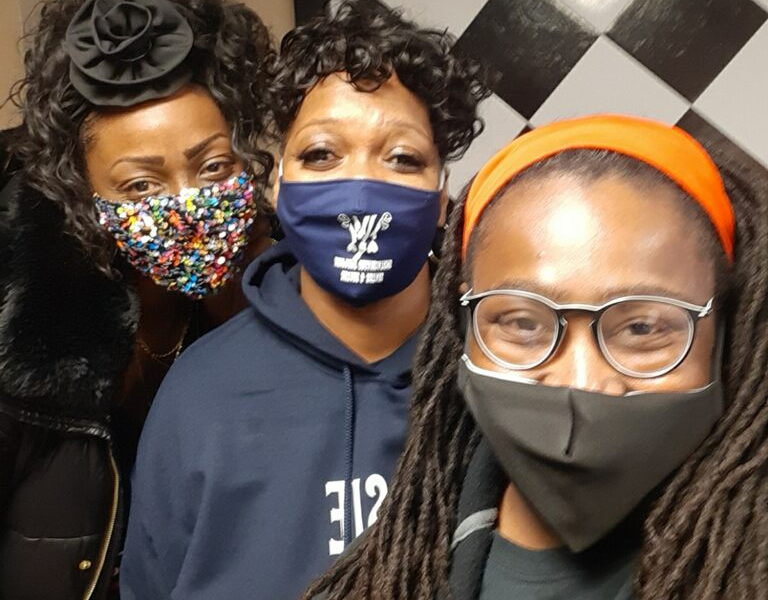 Sheena Greene, right, and other volunteers at the November curbside giveaway.