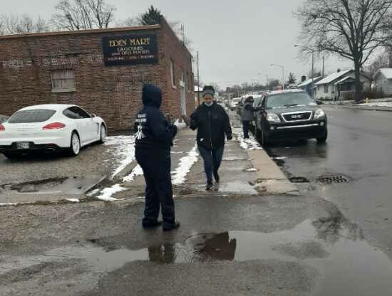 Cars lineup on Oxford Street for the November curbside giveaway.