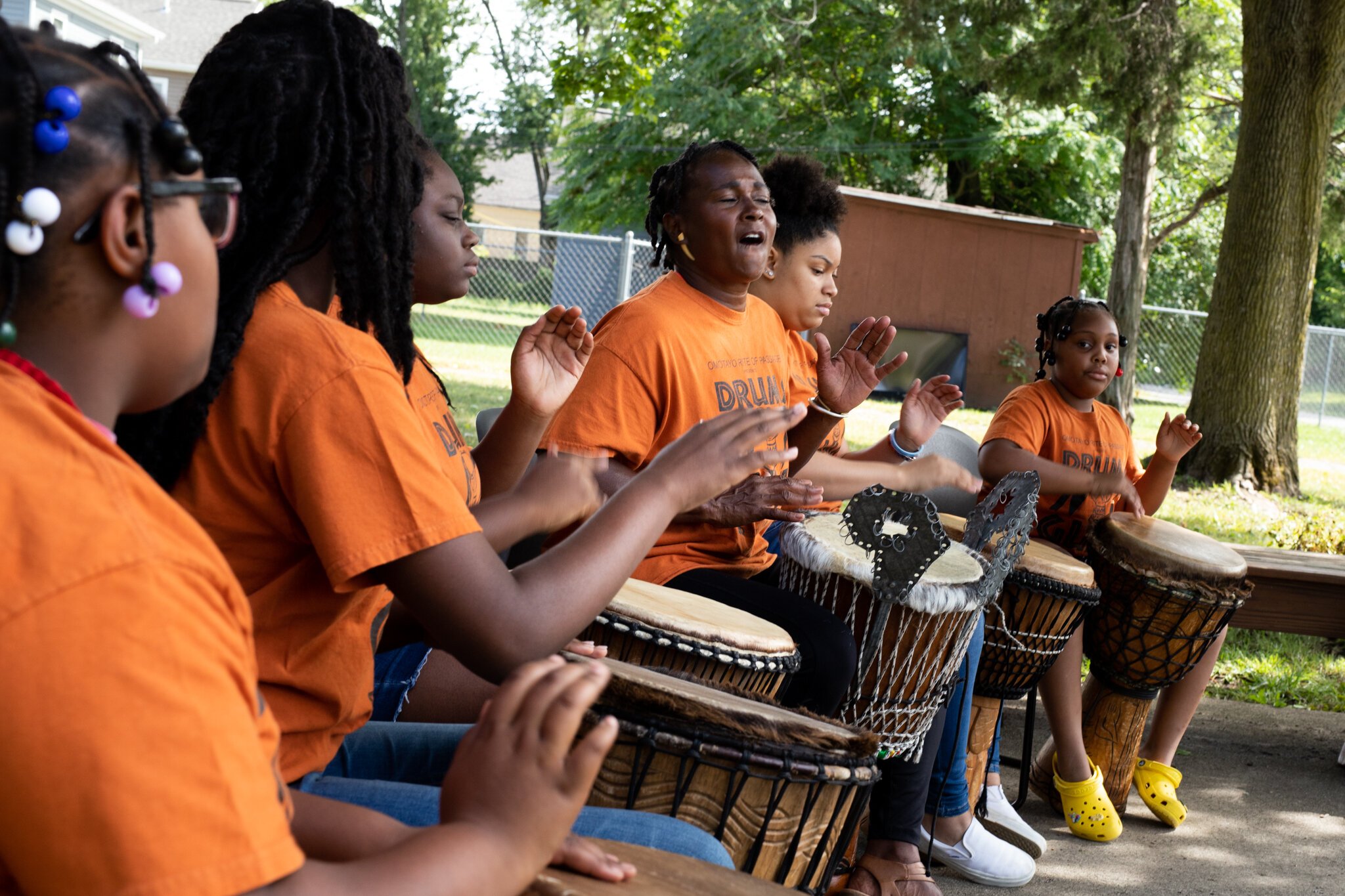 Diane Rogers, center, leads the Omotayo Rite of Passage drumming and dance program.