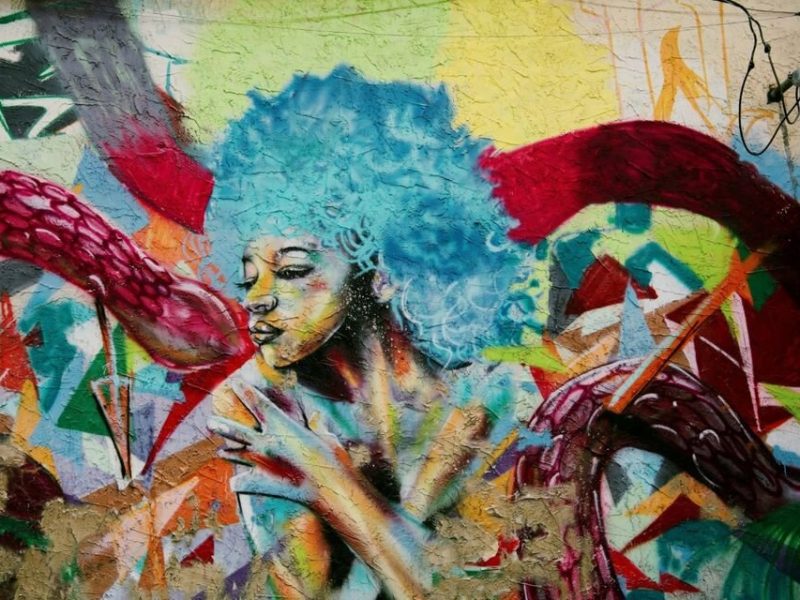 A mural by artist Theopolis Smith, aka Phresh Laundry, on the side of Wunderkammer Company.