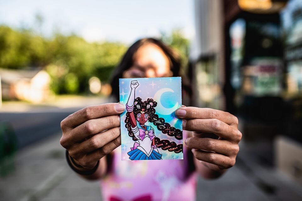 Debbi Kuntz is creating Kawaii style art with a Black Lives Matter theme for Mosaic Market.