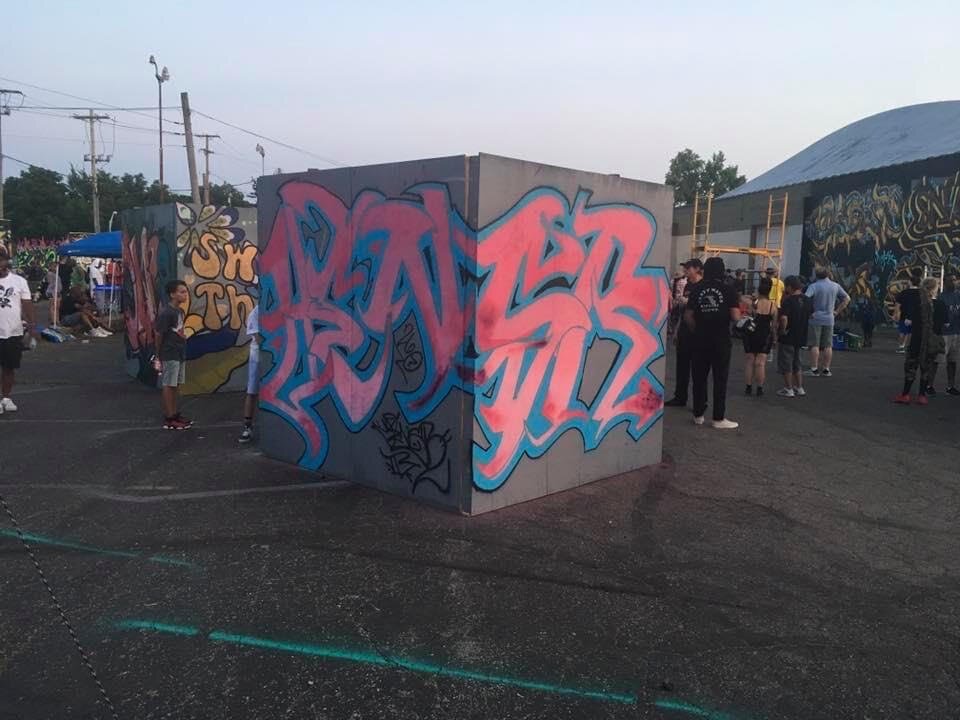 Graffiti art on temporary walls at a 2X2Fest in Columbus.