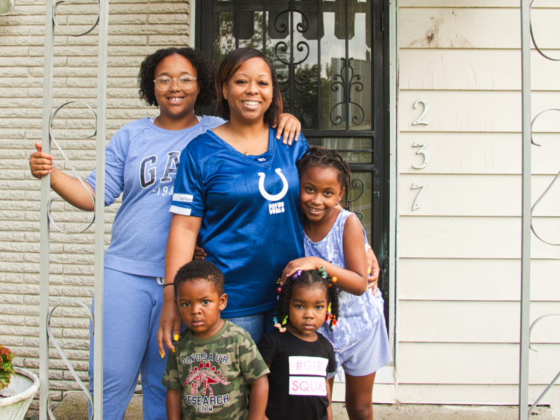 Kendra Smiley and her daughters Kendall and Kenyale as well as two of the children she cares for at her home-based daycare service.