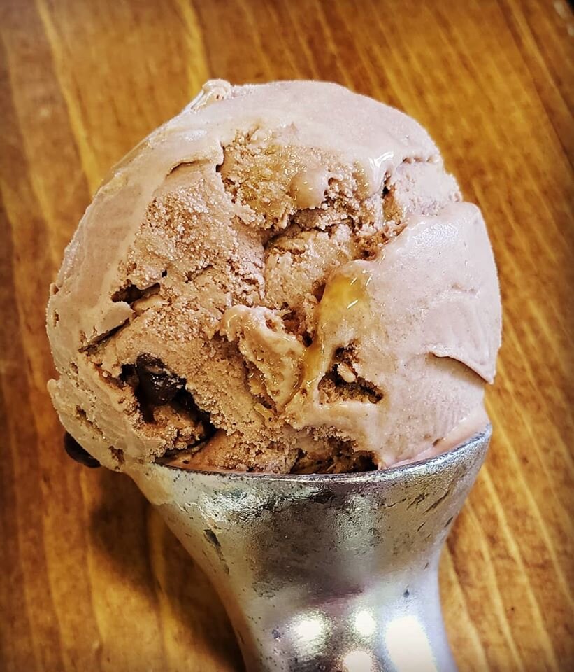 "Bittersweet Symphony" is an amaretto chocolate ice cream with chocolate chips and a salted caramel swirl.
