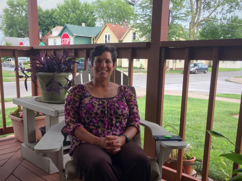 Rebecca Ridley enjoys her front porch in the Renaissance Pointe neighborhood.