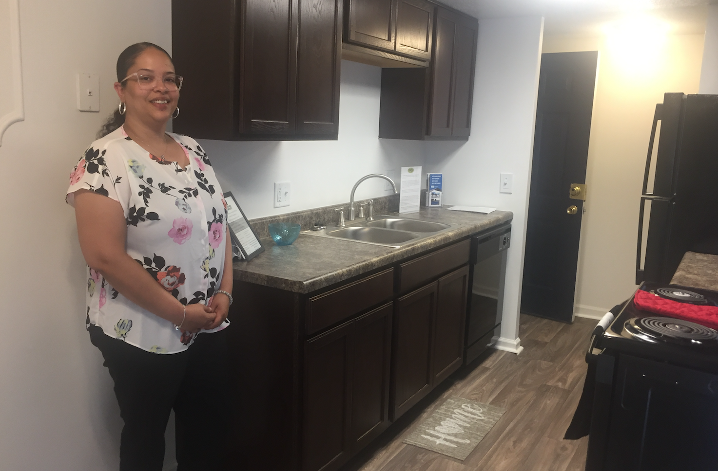 Bradtmueller shows off a fully renovated, model apartment.