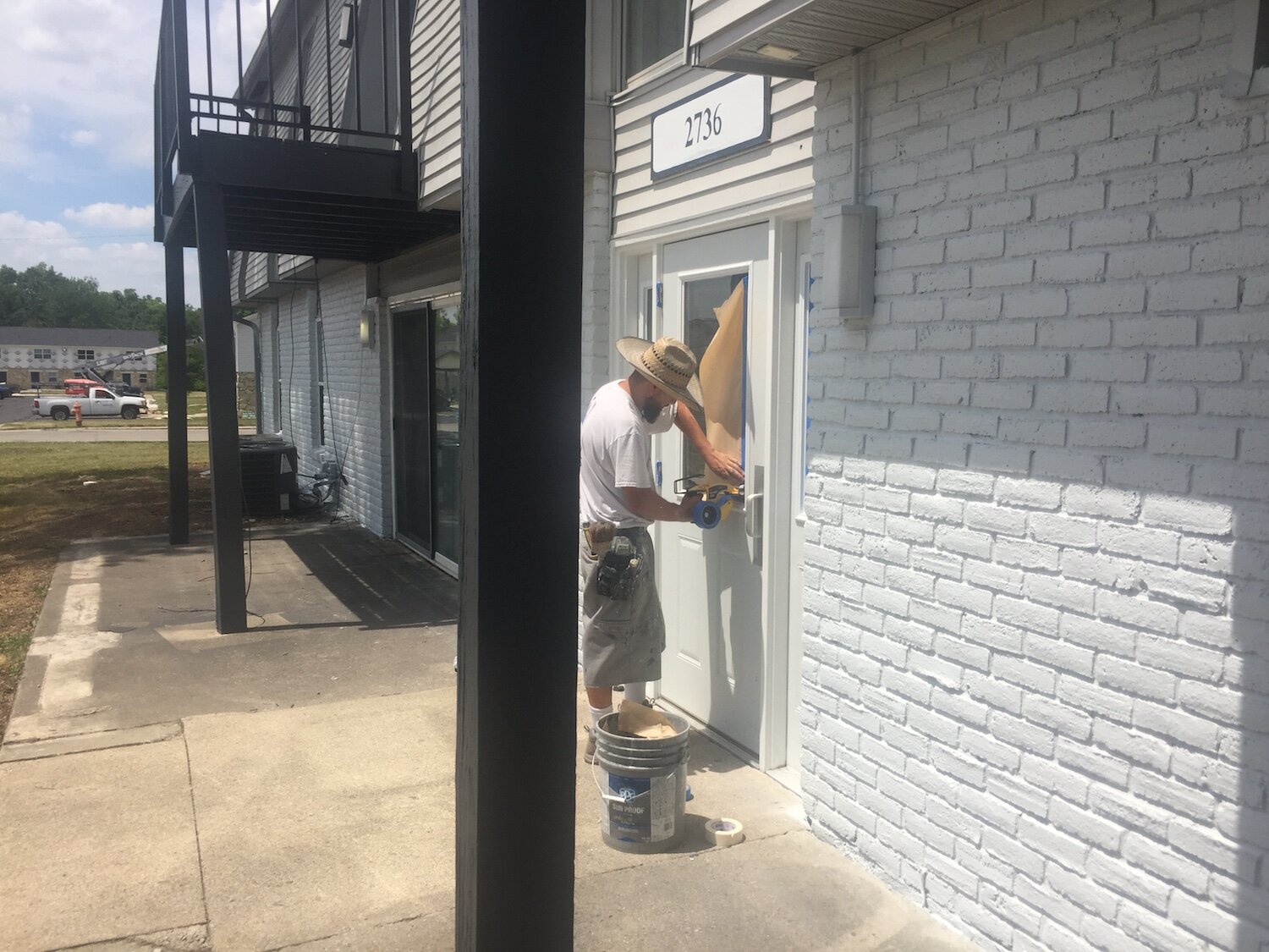 Construction workers modify exteriors at Parkview Village.