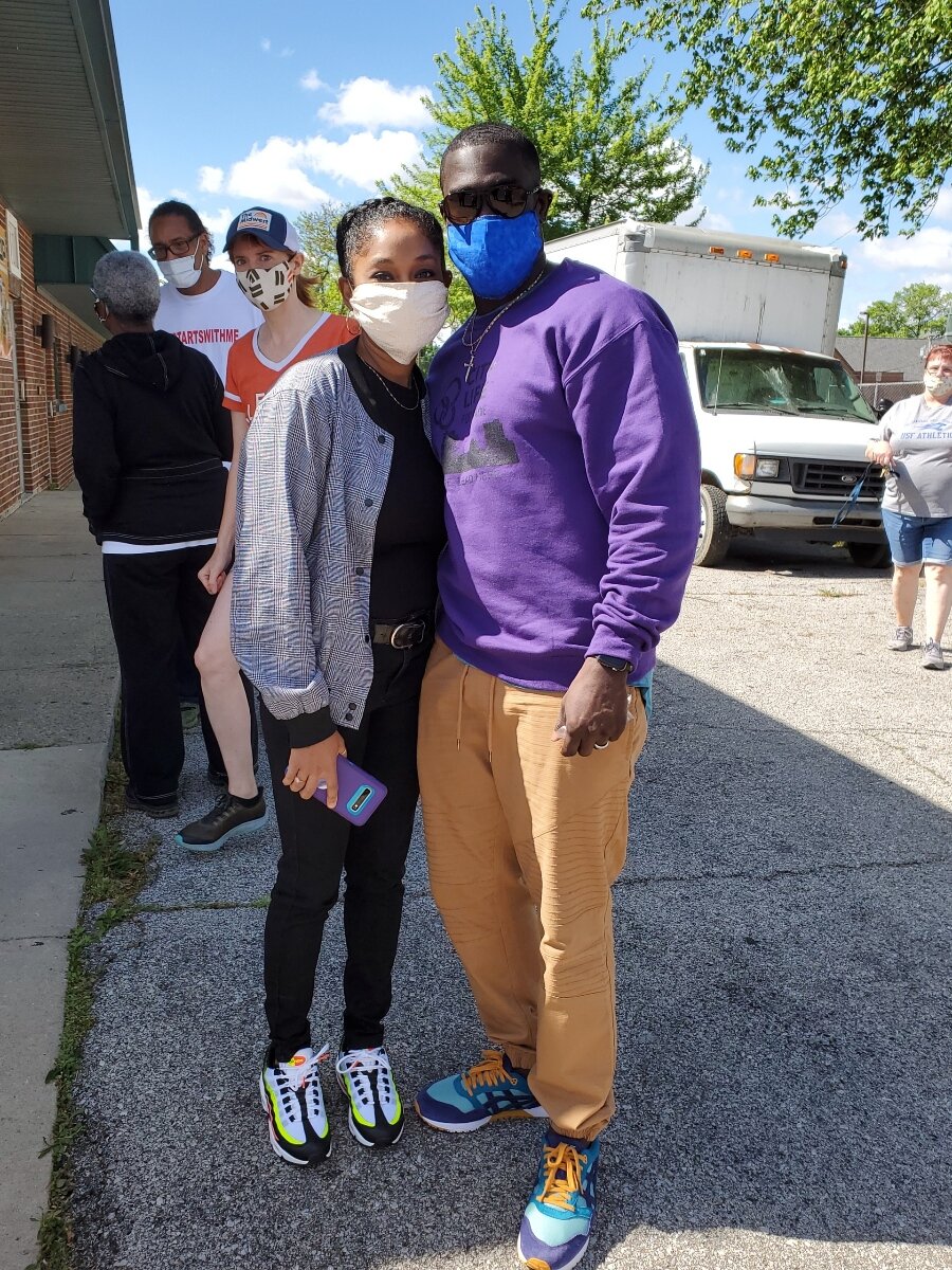 Janell and Aaron Lane volunteer with the Human Agriculture Cooperative's Free Food Giveaway.