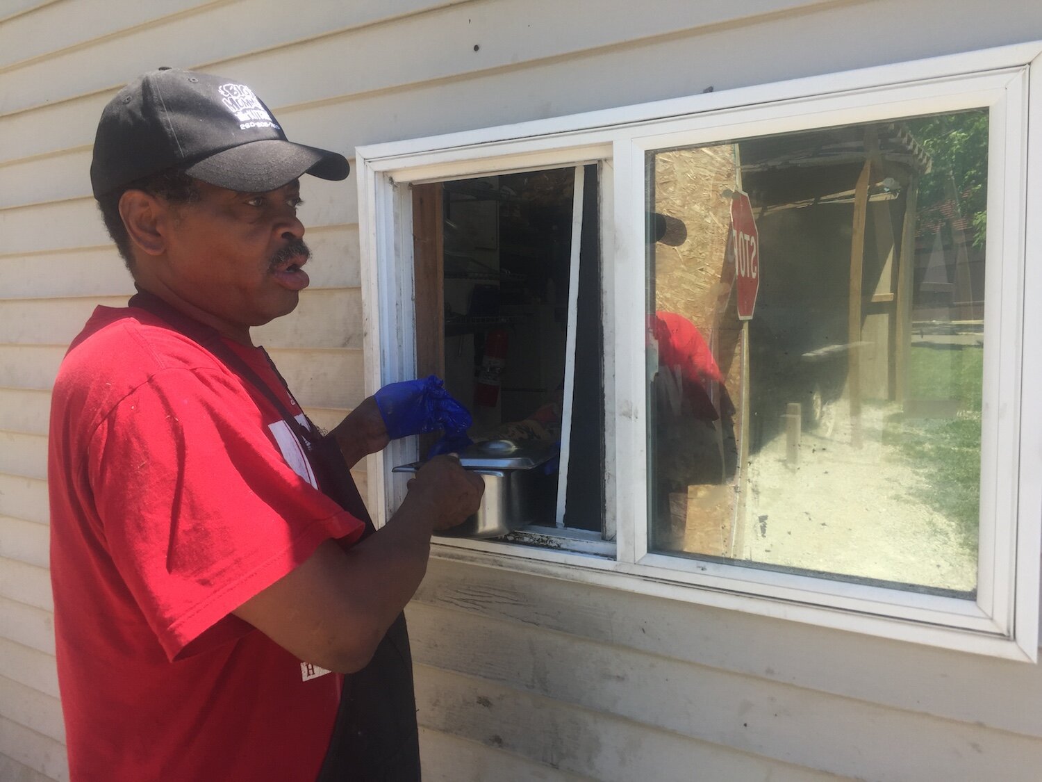 Grill Master Jewels delivers ribs hot off the grill through the side window.