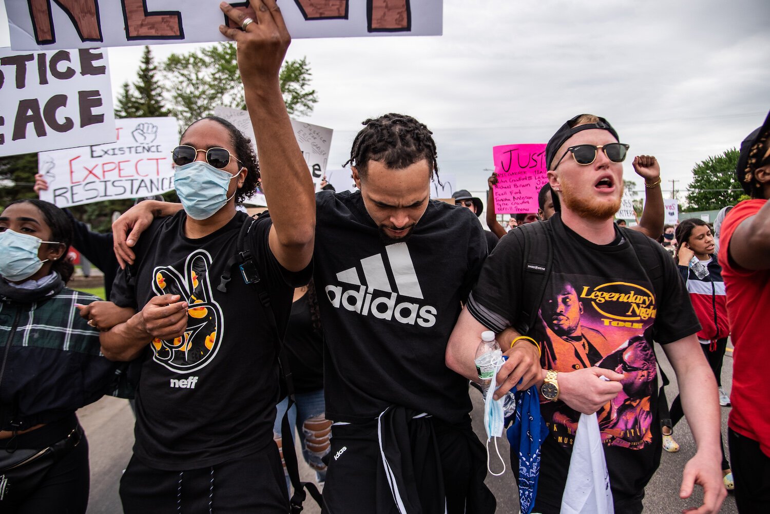 Gil Melvin, Rondo Sanders and Steven Green march toward downtown Mount Pleasant during an event to protest the death of George Floyd and social injustice June 1 on Mission Street in Mount Pleasant, MI.