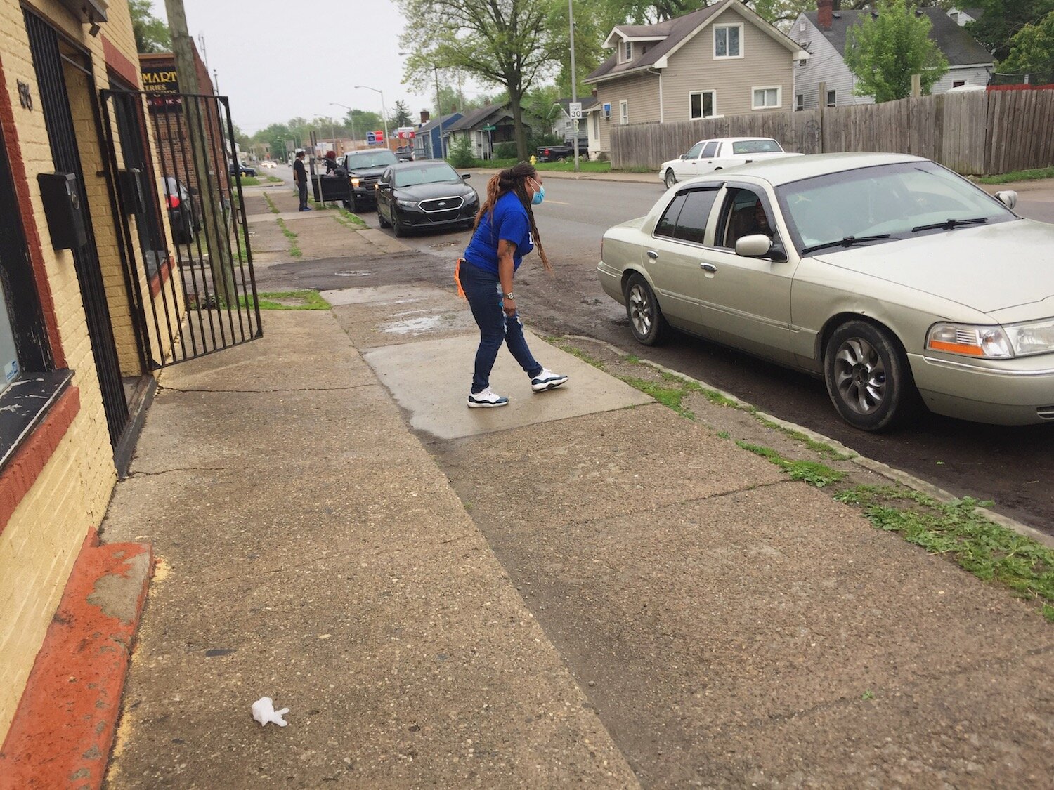 Volunteers chat with residents in their cars to provide them with community during COVID-19.