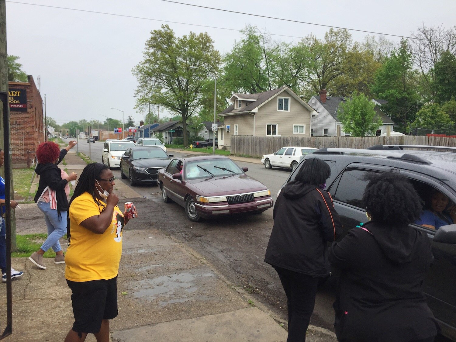 Vehicles line up on Oxford Street for the BBQ.