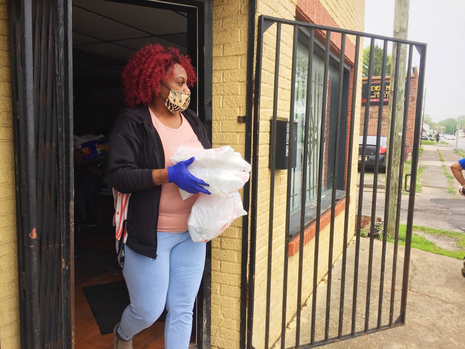 Volunteers with the Curbside BBQ wear masks and gloves to ensure health safety.