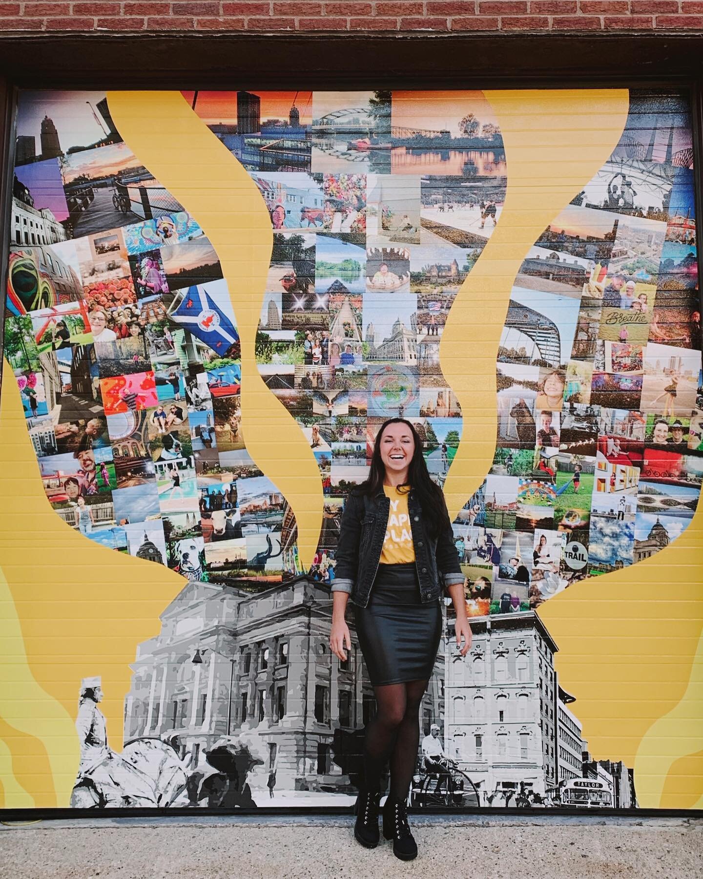 Olivia Ulch stands in front of the My Happy Place mural she created for Fort Wayne in 2019.