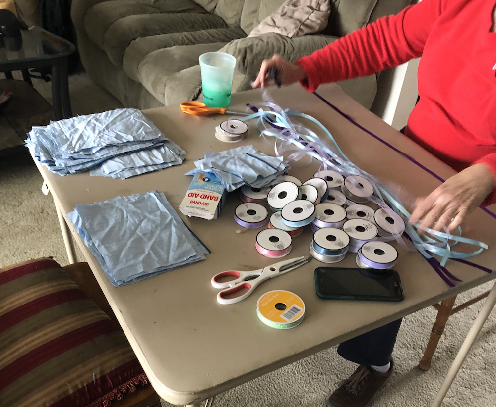 SFWCR teaches people how to make masks.