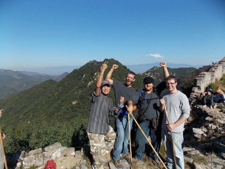Cook, far right, and his friends during his time in China.