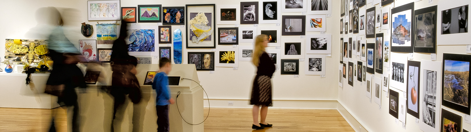 Patrons browse the 2019 Scholastic Art and Writing displays at the Fort Wayne Museum of Art.
