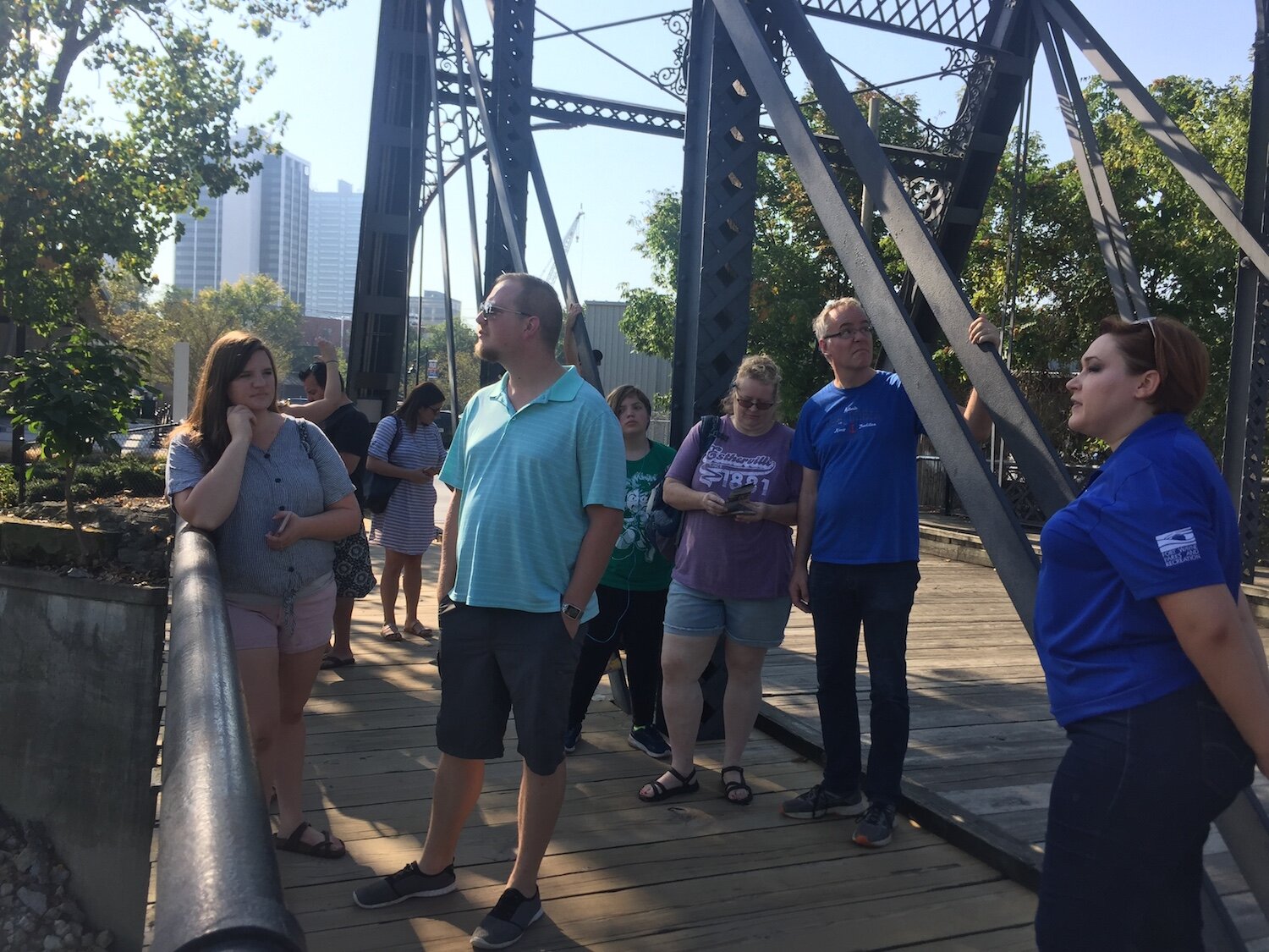 A group of travel writers tour the downtown Fort Wayne riverfront and Promenade Park.