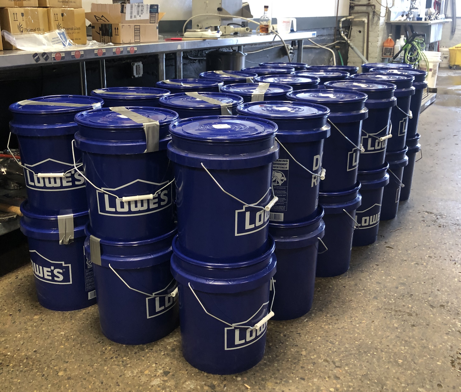 Buckets of hand sanitizer waiting to go out.