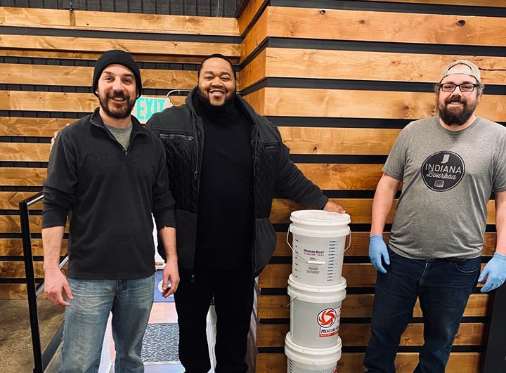 Members of the Richard Lugar Safe Haven for Veterans pick up hand sanitizer.