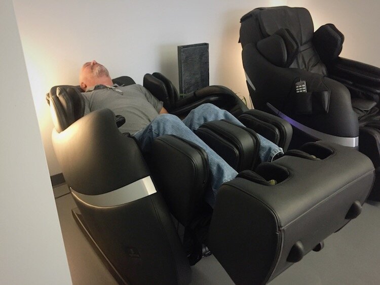 Craig Traxler reclines in the Positive Posture massage chair.