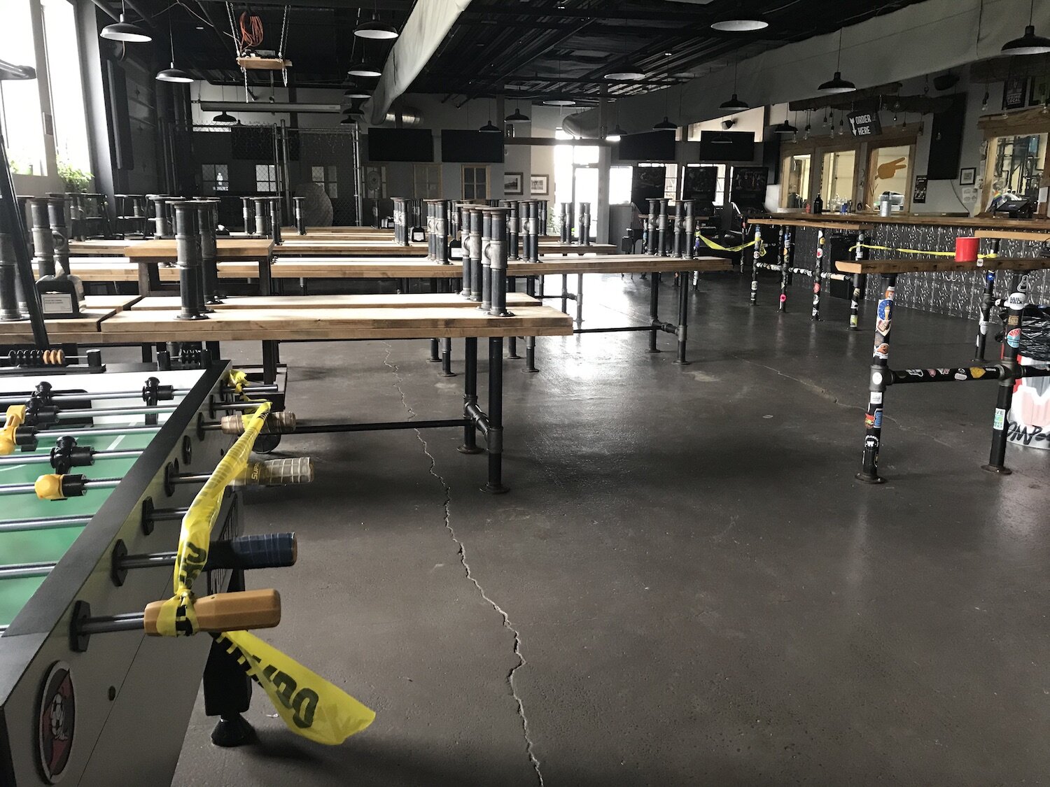 Empty chairs on empty tables as Hop River Brewing closes for COVID-19.