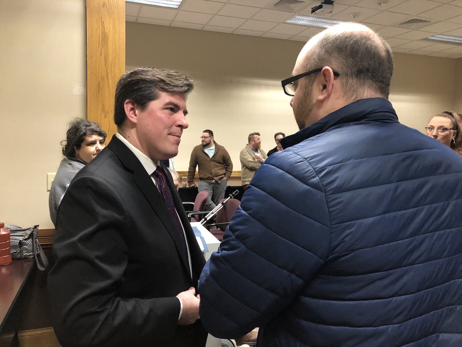 Mayor Strick, left, meets with residents.