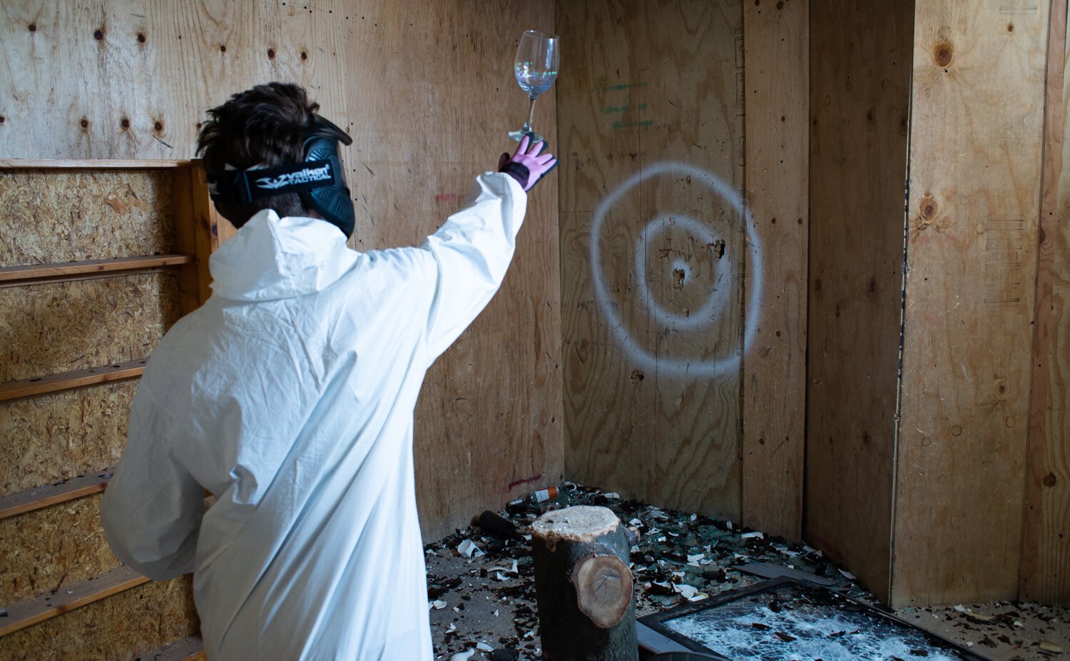 Brianna Dailey throws a glass at the target at All the Rage.