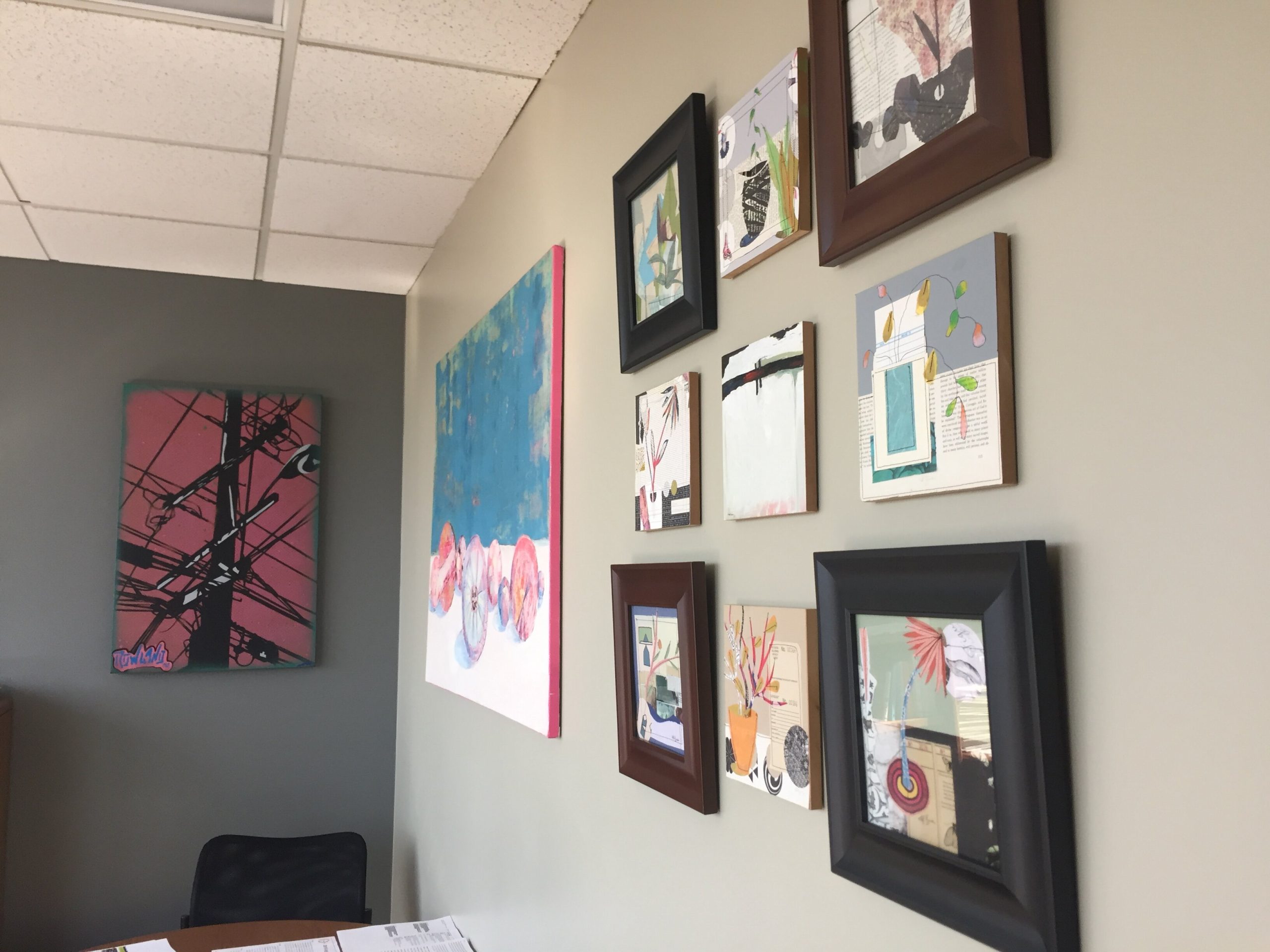 Colorful, local art covers the walls of Robinson's Greater Fort Wayne Inc. office.