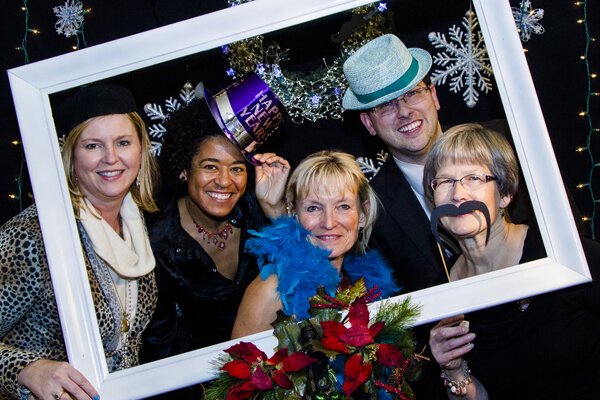 Robinson poses with a group at the Manchester Main Street 2013 Holiday Gala.