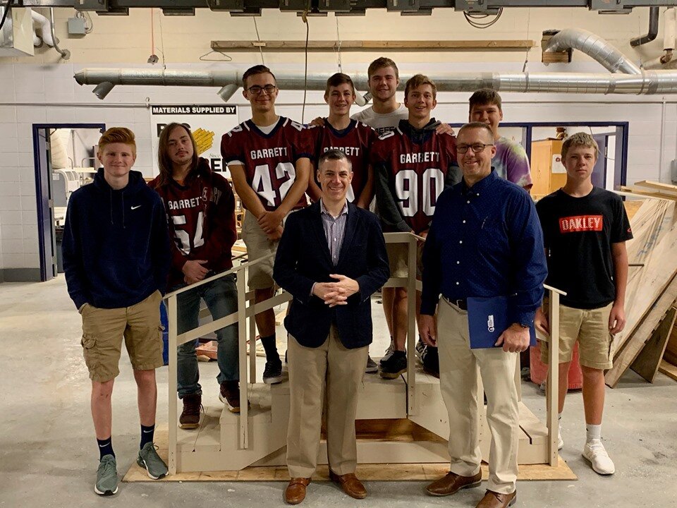 Garrett High School teacher Chad Sutton, right, with some of his students.