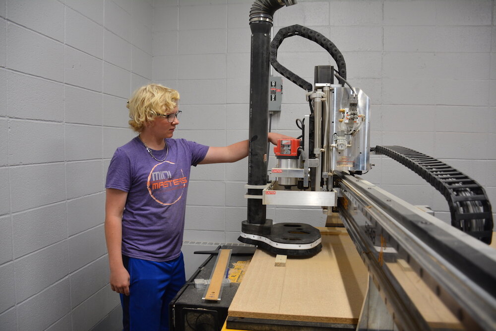 Garrett students get practice using machinery.