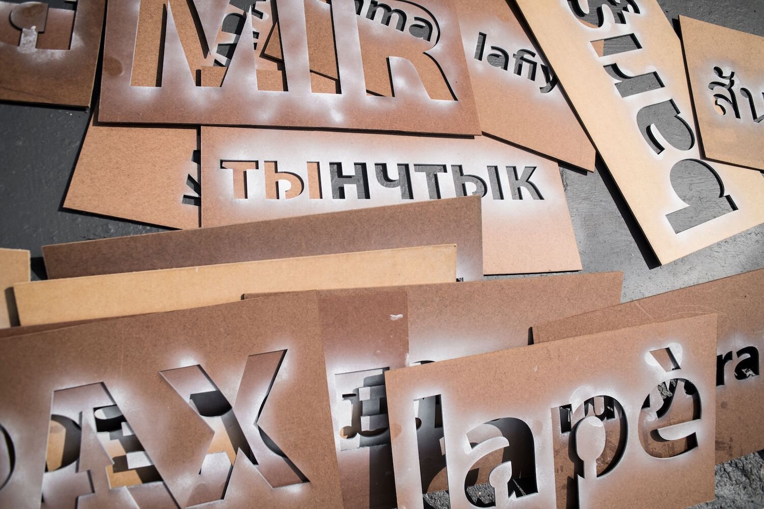 Swartz hops to make stencils for the Peace Mural available for the public to use other places around town.