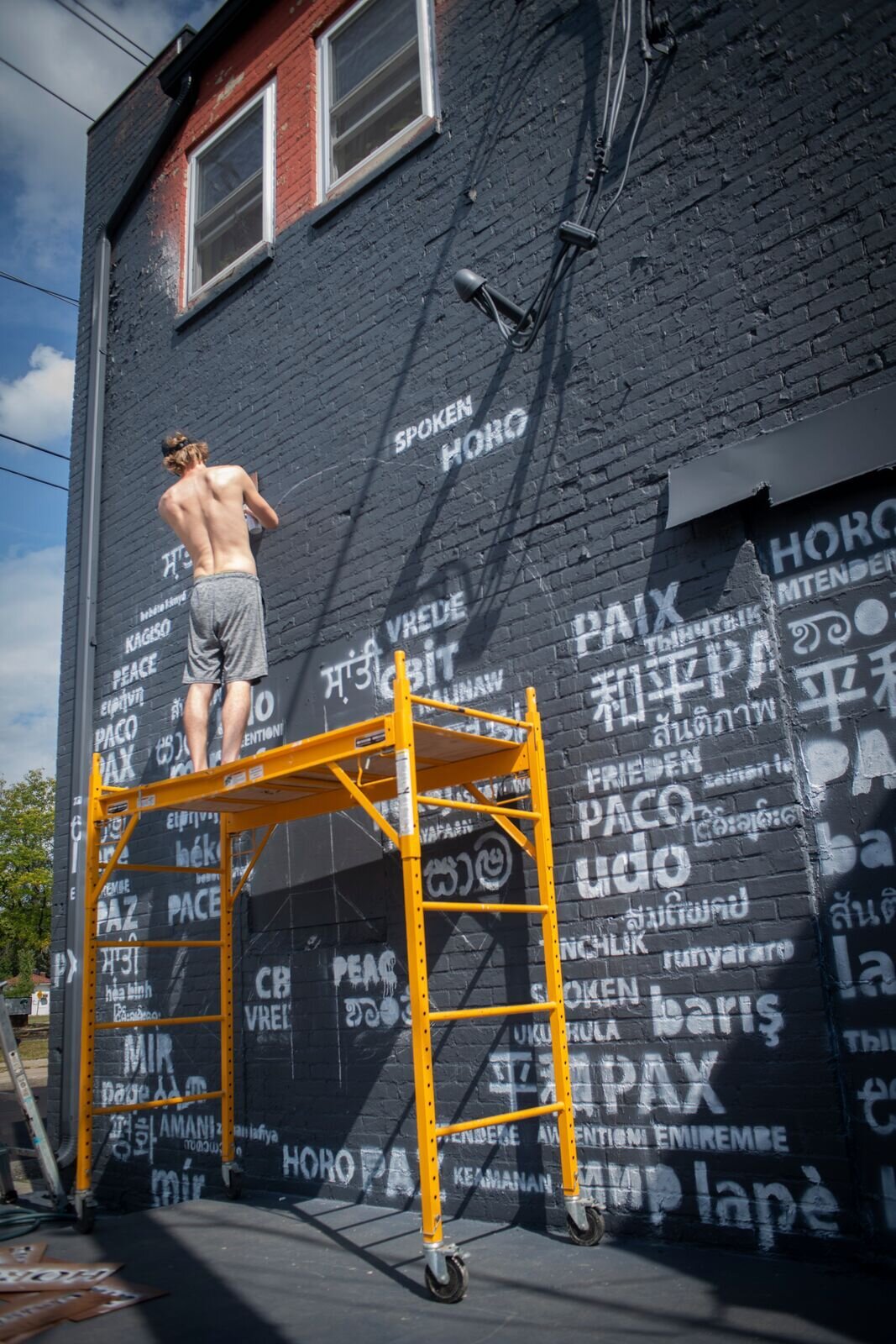 The Peace Mural takes shape on Wunderkammer's west side.