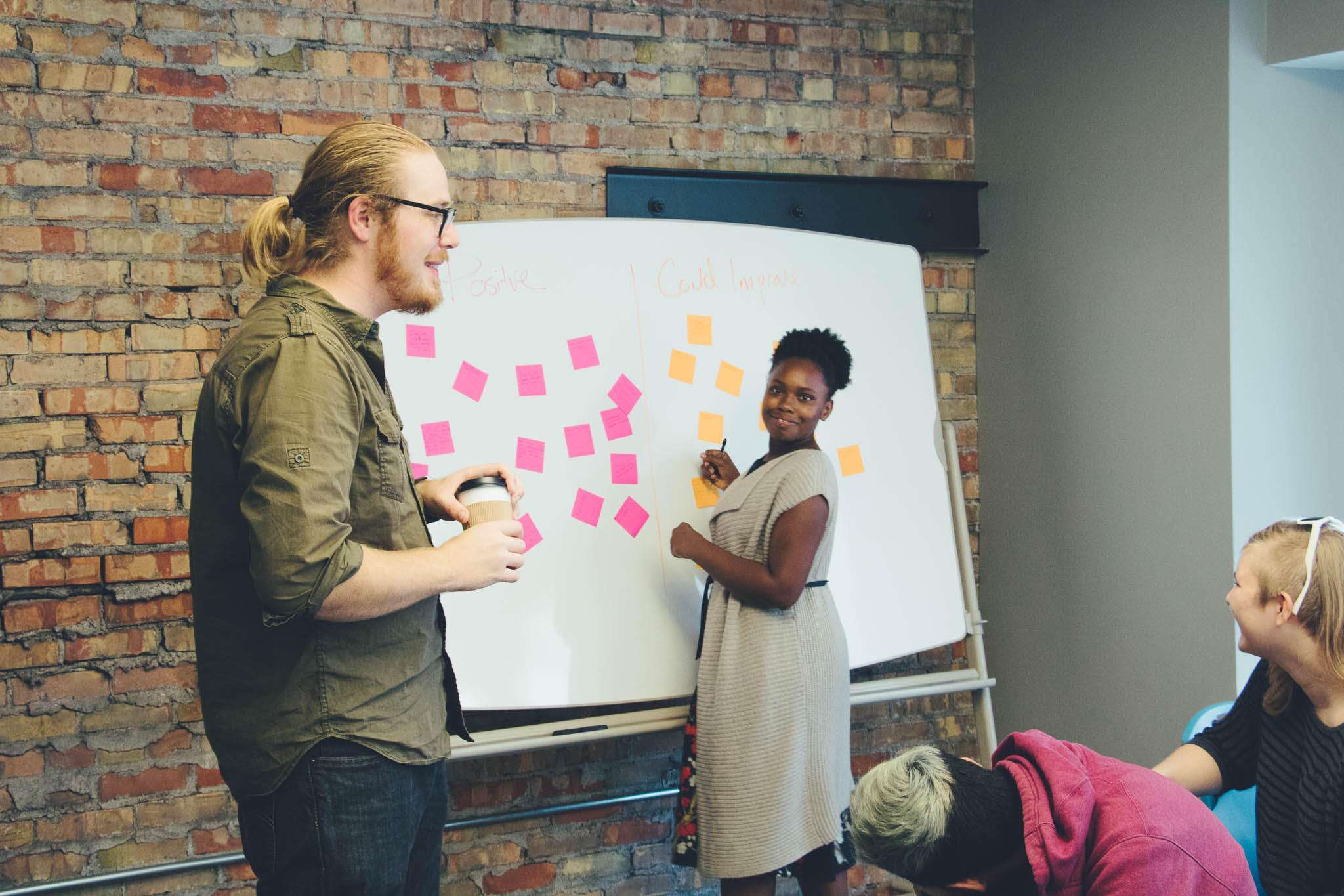 Jon Rehwaldt, left, facilitates class sessions at Atrium.