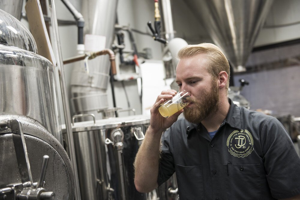 Brewers taste test beer behind-the-scenes at Junk Ditch.