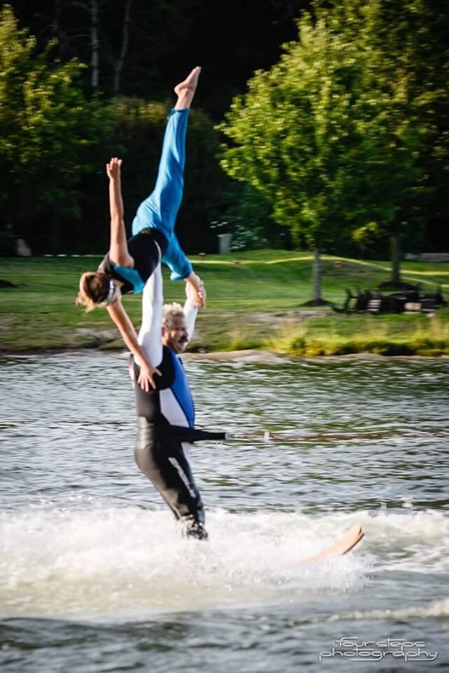 Members of the Lake City Skiers perform a lift.