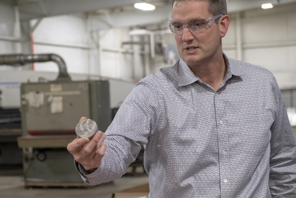 QuikCut CEO Mark Webb shows an example of his company’s work.