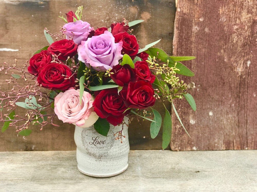 Kari and Joshua Heim's business in Warren brings their creative talents in flowers and pottery together.