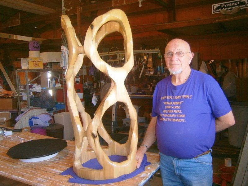 Rose stands next to his latest piece for the 2019 Decatur Scupture Tour, title “8-EIGHTY-8.”