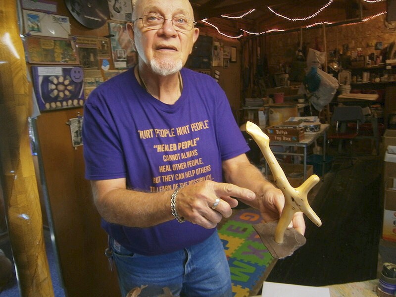 Rose talks about some of his other pieces in his personal workshop. This sculpture was made from a tree root.
