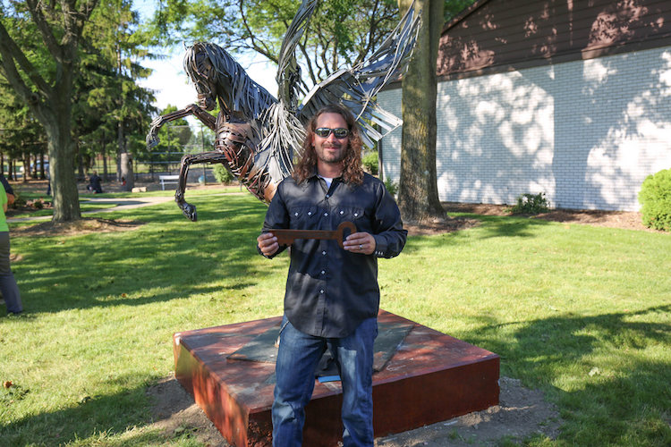 Greg Mendez received a Key to the City of Decatur for his work starting the Sculpture Tour.