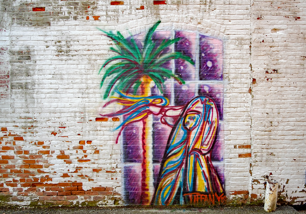 A mural by Greg Mendez's wife, Tiffany, in the alley at ACE 40.8 in Decatur.