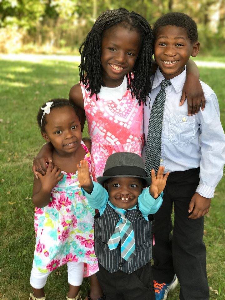 Francesca, center, and other children Ray of Hope serves.