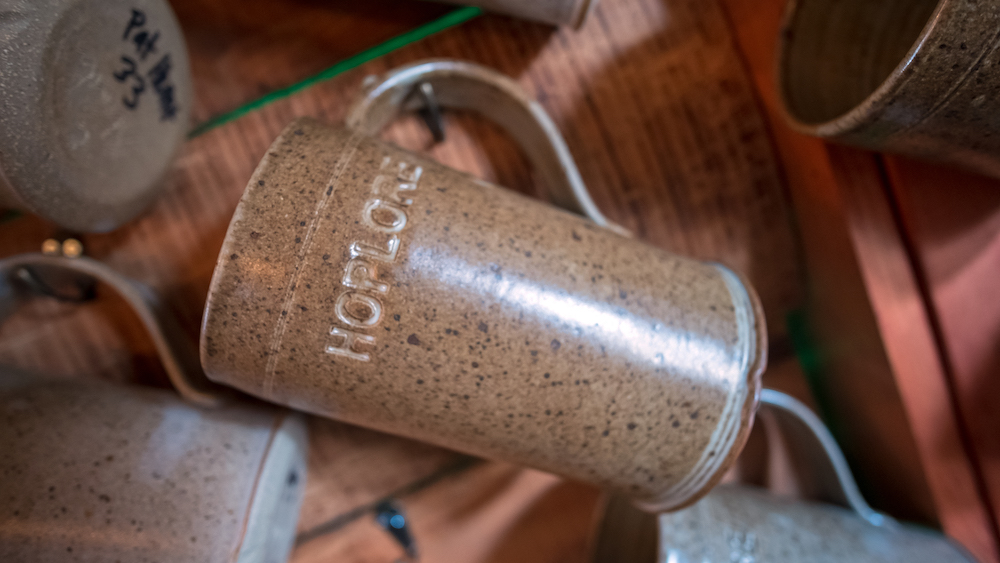 As part of HopLore's community spirit, guests hang personalized beer mugs on the wall.