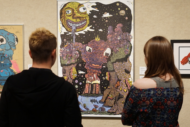 Visitors admire a piece during the opening reception of the 39th National Print Exhibition at Artlink.